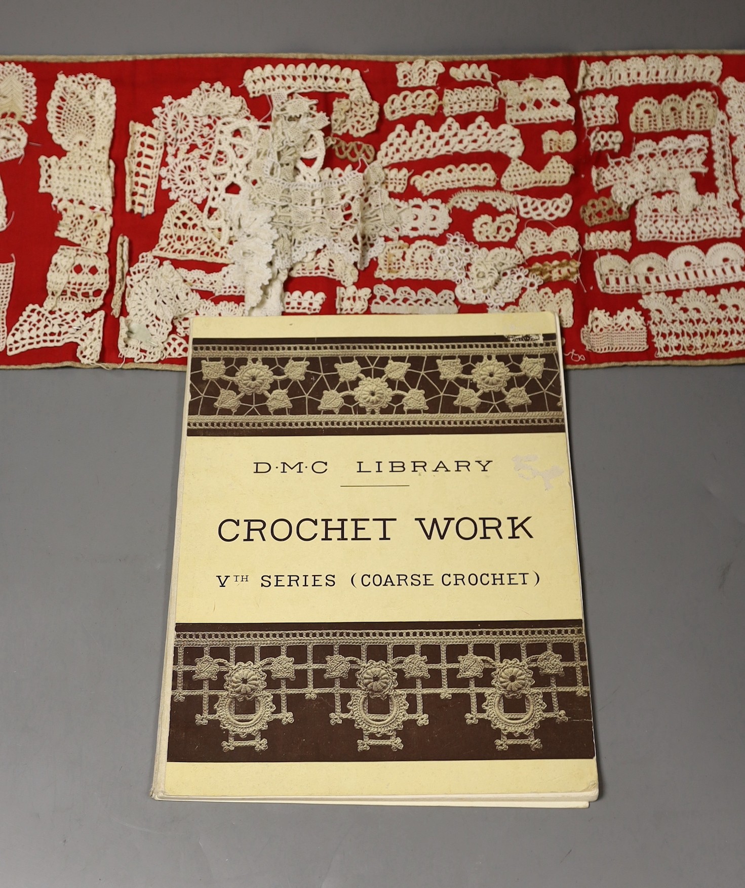 A collection of different crochet worked motifs and panels together with the DMC Library crochet work book